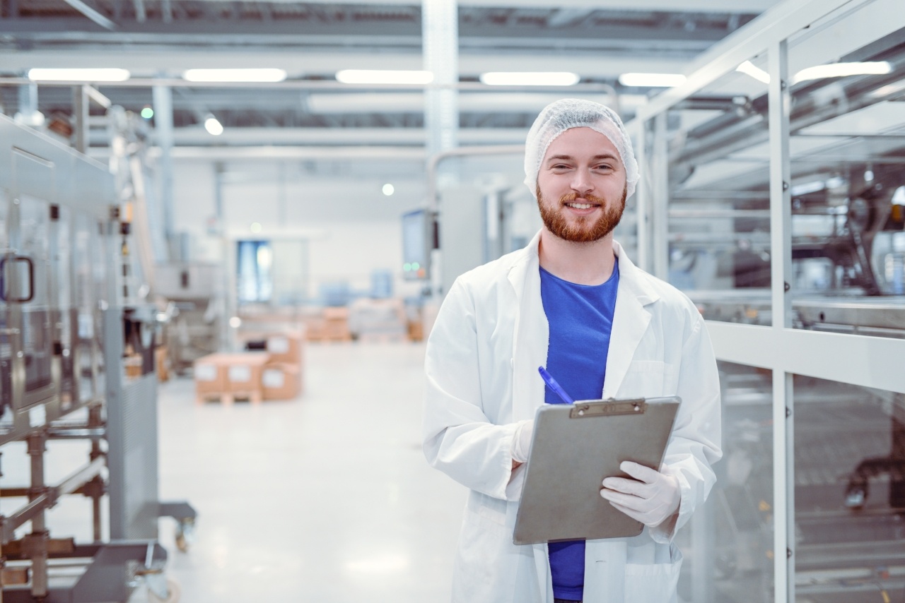 Scientist With Clipboard Posing in Factory_iStock-866799478-252813-edited