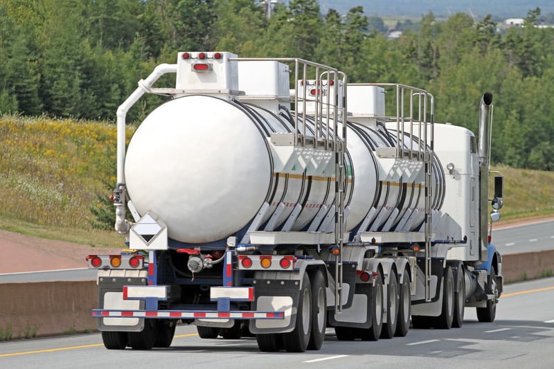 semi-tanker-truck-traveling-highway-with-chemical-cargo