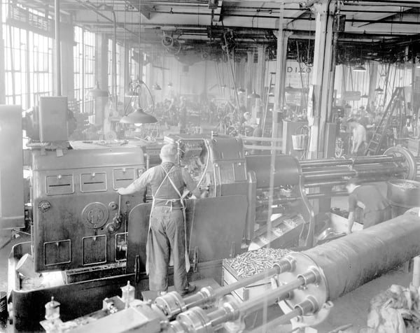 Black and white image of a screw spindle machine in a Dixon manufacturing facility