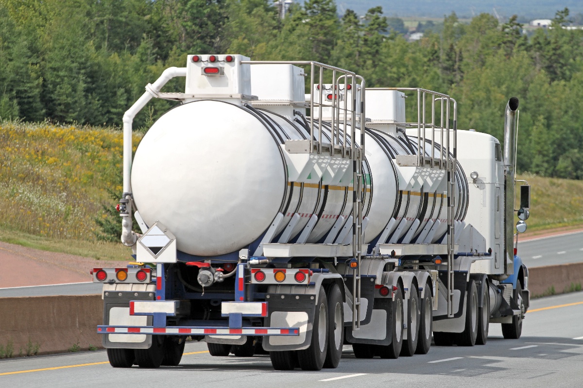 iStock-950131304 - Semi Tanker Truck Travelling Highway With Chemical Cargo-1