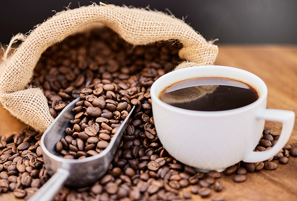Cup of coffee and coffee beans